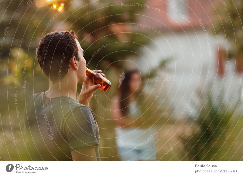 Drinking beer Beer Bottle Summer vacation Human being Masculine Young man Youth (Young adults) Friendship 1 18 - 30 years Adults Observe To enjoy Cool (slang)