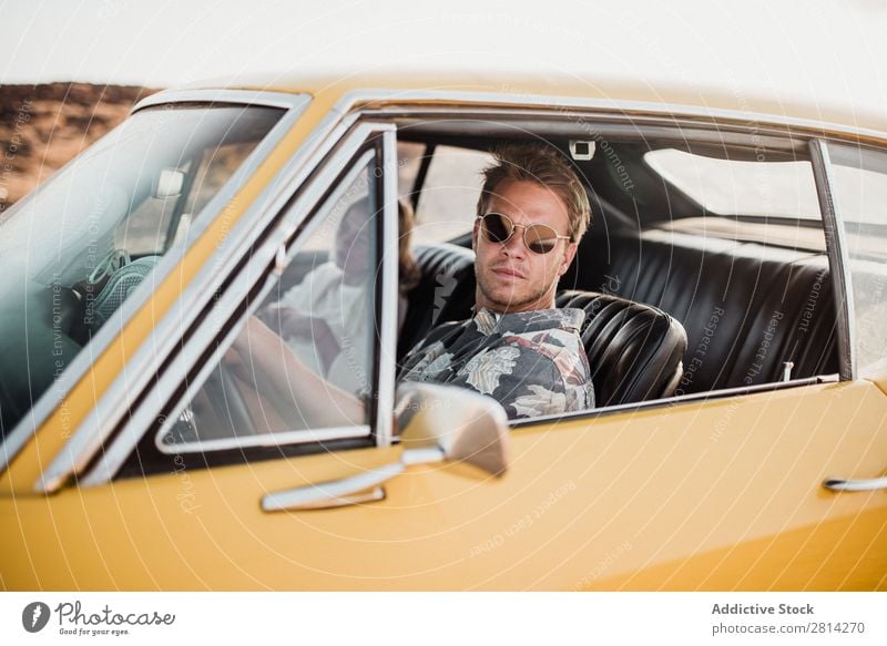 Couple sitting in car Car Love Sunglasses Looking into the camera Cool (slang) Style Hip & trendy Vehicle Man Woman Lifestyle Together Vacation & Travel Happy