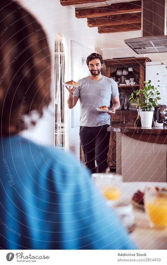 Happy couple having breakfast together Home Youth (Young adults) Grapefruit 2 Breakfast Man Easygoing Human being Life Woman Adults Girl Husband dining Bread