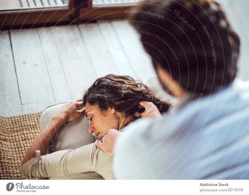 Young couple. Man massaging a woman Woman Barefoot couch massaging Couple Heterosexual couple Easygoing Human being Adults Lie (Untruth) Home Massage Couch