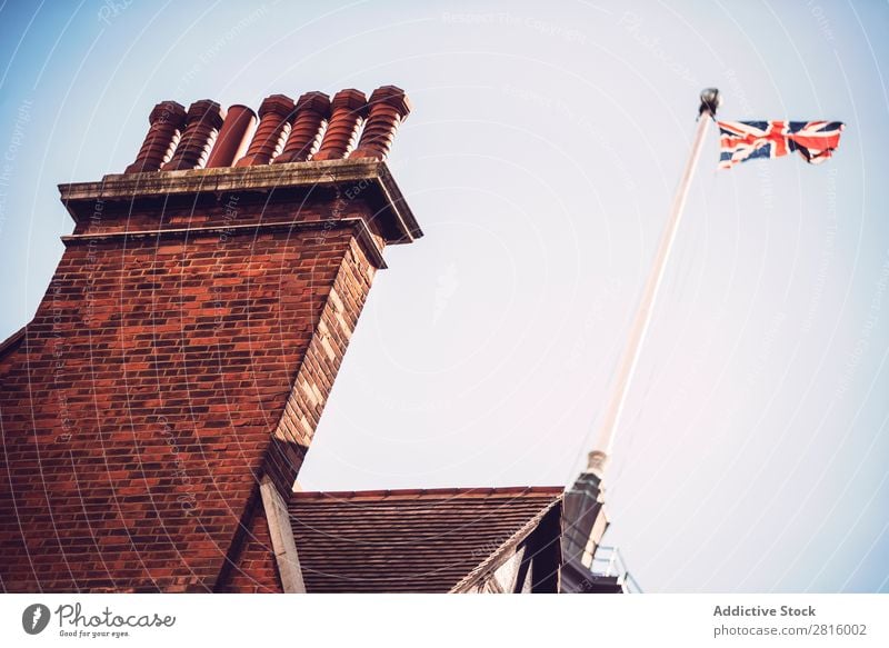 British flag on a building Flag Hang Building patriotic national Wall (building) Street City Town Old London Horizontal Exterior shot Deserted Great Britain