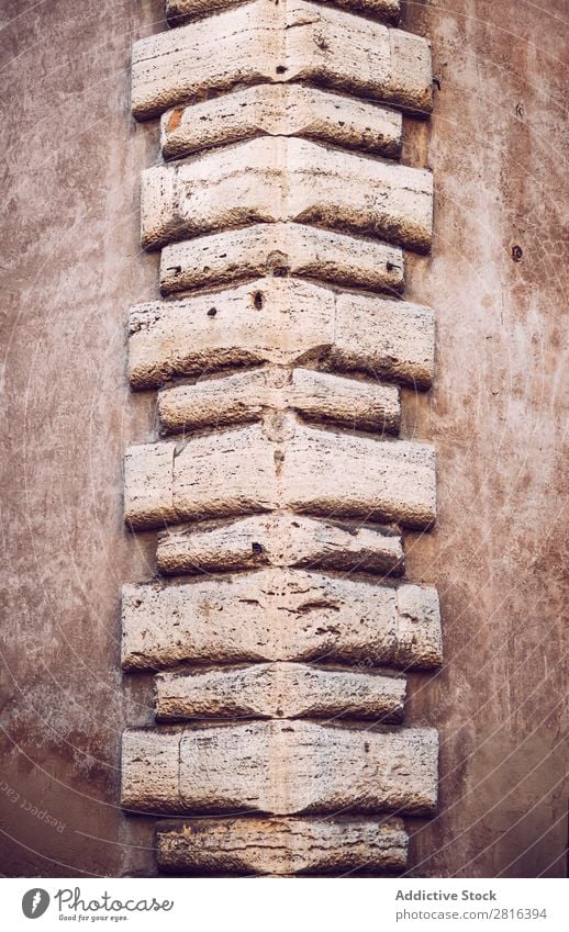 Corner of a building texture background. Rome, Italy Building Brick Stone Surface Decoration Cement Rough Square Old Ornament Tile Brown Masonry brickwork