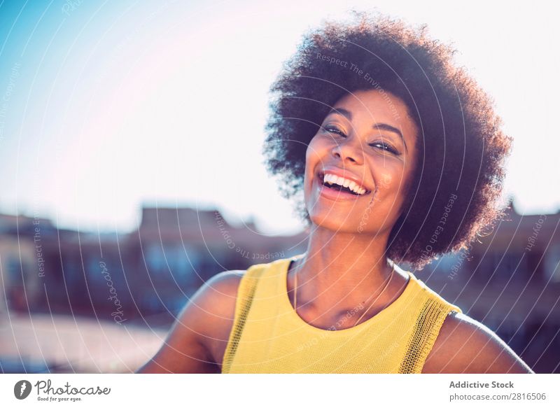 Beautiful African girl with curly hair on the rooftop Fashion Skin fashionable Clothing Street vogue Model Attractive copy Racing sports pose glamour Commercial