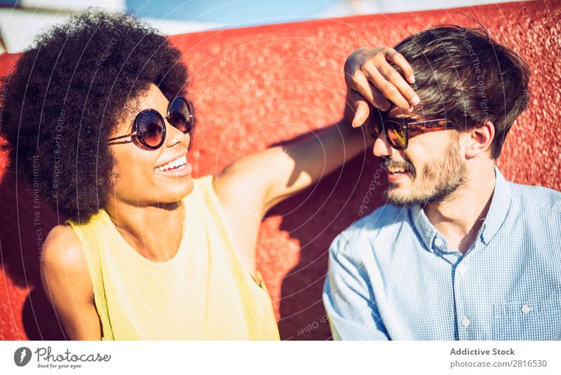 Interracial couple having fun on the rooftop Ethnic Youth (Young adults) Racing sports Caucasian Exterior shot Park African-American Boy (child) interracial