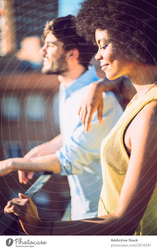 Interracial couple having fun on the rooftop Ethnic Youth (Young adults) Racing sports Caucasian Exterior shot Park African-American Boy (child) interracial