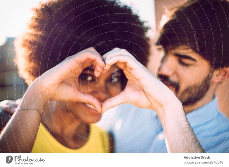 Interracial couple having fun on the rooftop Ethnic Youth (Young adults) Racing sports Caucasian Exterior shot Park African-American Boy (child) interracial