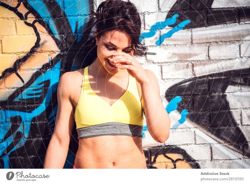 Sporty woman Posing near Urban Wall Grafitti Graffiti Wall (building) Clothing Joy Adults Human being Woman Posture Youth (Young adults) Girl Face Colour