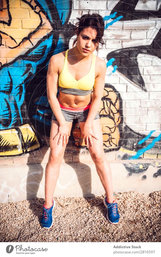 Sporty woman Posing near Urban Wall Grafitti Graffiti Wall (building) Clothing Joy Adults Human being Woman Posture Youth (Young adults) Girl Face Colour