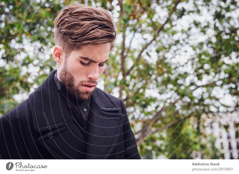 Young handsome trendy man with coat posing on stairs Adults Attractive Beard bearded Boy (child) Easygoing Caucasian Cool (slang) Cute Deep Expression