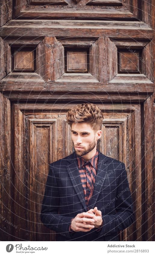 Handsome elegant young fashion man in trendy costume suit, old door wooden background Suit Man Gentleman Fashion fashionable Clothing Style Model Shirt