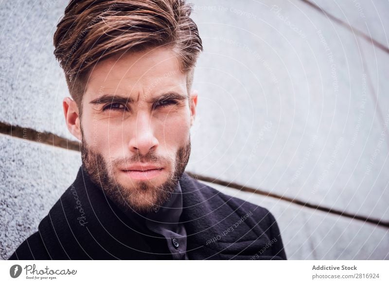 Young handsome trendy man with coat posing on stairs Adults Attractive Beard bearded Boy (child) Easygoing Caucasian Cool (slang) Cute Deep Expression