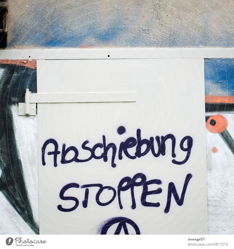 Deportation STOP Characters Graffiti Rebellious Town Blue Red Black White Moody Optimism Solidarity Help Revolt Argument Require Freedom of expression