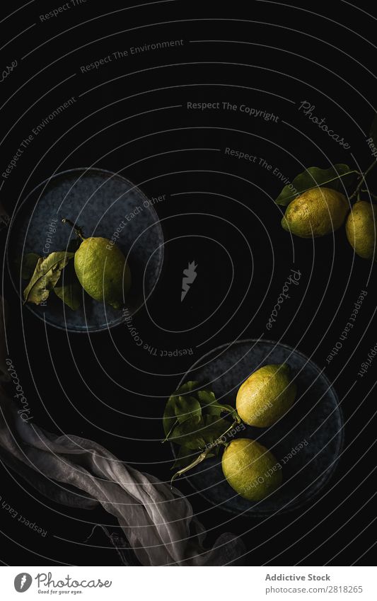 Fresh ripe citrus. Lemons, limes on dark background Lime Black Background picture Dark Fruit Green Copy Space Slate Group Sliced Food Juicy Vegetarian diet