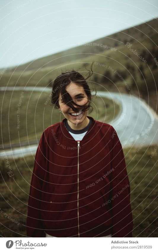 Happy woman at road in field Woman Field Street Asphalt Cheerful Smiling To make dirty Hair Nature Youth (Young adults) Vacation & Travel way Landscape