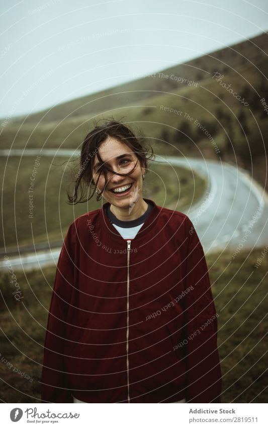 Happy woman at road in field Woman Field Street Asphalt Cheerful Smiling To make dirty Hair Nature Youth (Young adults) Vacation & Travel way Landscape