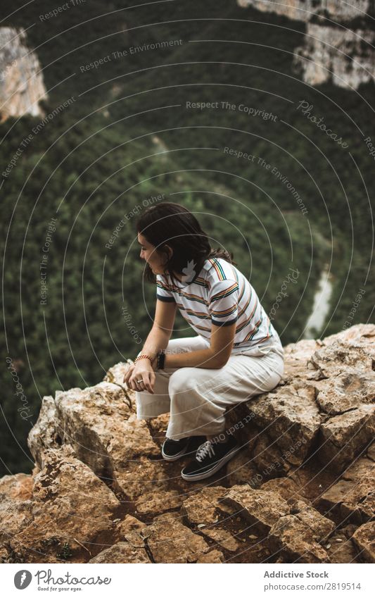 Woman sitting on stone Stone Mountain Nature Youth (Young adults) Girl Rock Vacation & Travel Summer Happy Human being Adventure Beautiful Landscape