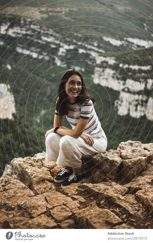 Smiling woman sitting on stone Woman Stone Mountain Nature Youth (Young adults) Girl Rock Vacation & Travel Summer Happy Human being Adventure Beautiful