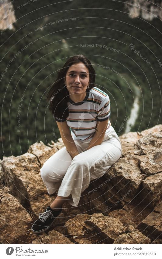 Woman sitting on stone Stone Mountain Nature Youth (Young adults) Girl Rock Vacation & Travel Summer Happy Human being Adventure Beautiful Landscape