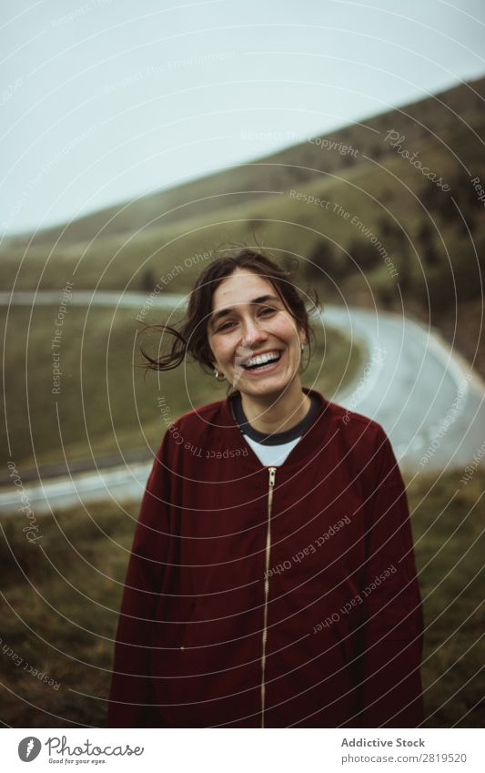 Happy woman at road in field Woman Field Street Asphalt Cheerful Smiling To make dirty Hair Nature Youth (Young adults) Vacation & Travel way Landscape