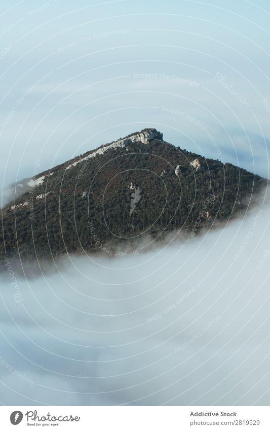 Mountain peak in thick clouds Peak Clouds Landscape Sky Nature Height Top Range White Dune Idyll scenery Blue sky Destination Wilderness Panorama (Format)