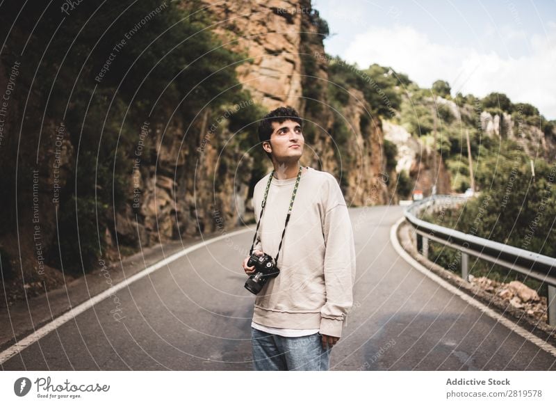 Man with camera walking in a rural road Camera Landscape Human being Attractive handsome Leisure and hobbies Trip Tourist Easygoing Nature Youth (Young adults)