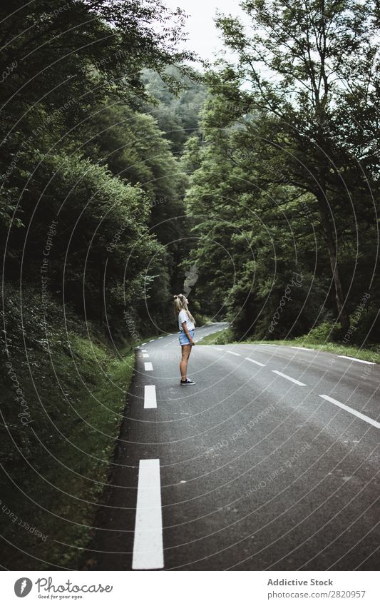 Woman walking on rod in woods Street Forest Walking Youth (Young adults) Nature Girl Lifestyle Vacation & Travel way Beautiful Asphalt Human being