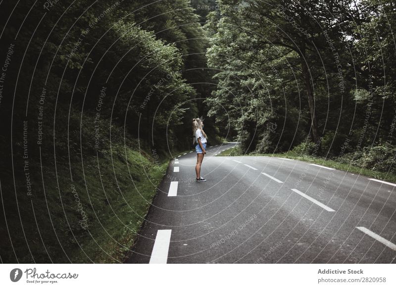 Woman walking on rod in woods Street Forest Walking Youth (Young adults) Nature Girl Lifestyle Vacation & Travel way Beautiful Asphalt Human being