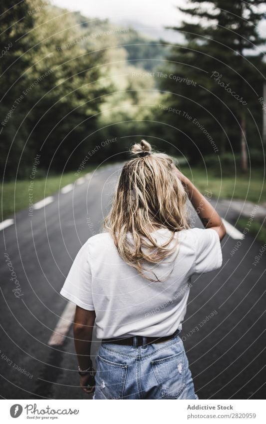 Woman walking on rod in woods Street Forest Walking Youth (Young adults) Nature Girl Lifestyle Vacation & Travel way Beautiful Asphalt Human being