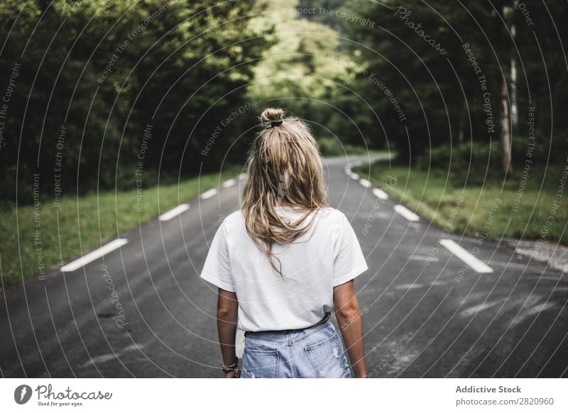 Woman walking on rod in woods Street Forest Walking Youth (Young adults) Nature Girl Lifestyle Vacation & Travel way Beautiful Asphalt Human being