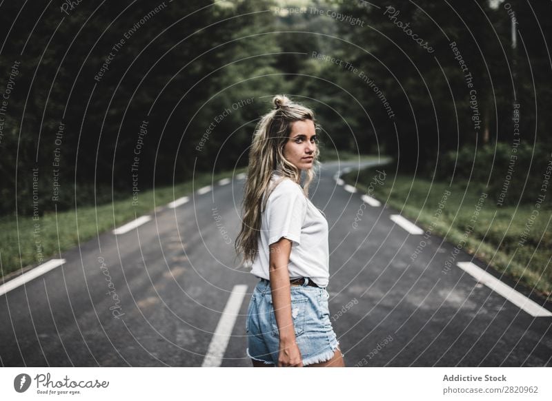 Woman walking on rod in woods Street Forest Walking Looking back over shoulder Youth (Young adults) Nature Girl Lifestyle Vacation & Travel way Beautiful