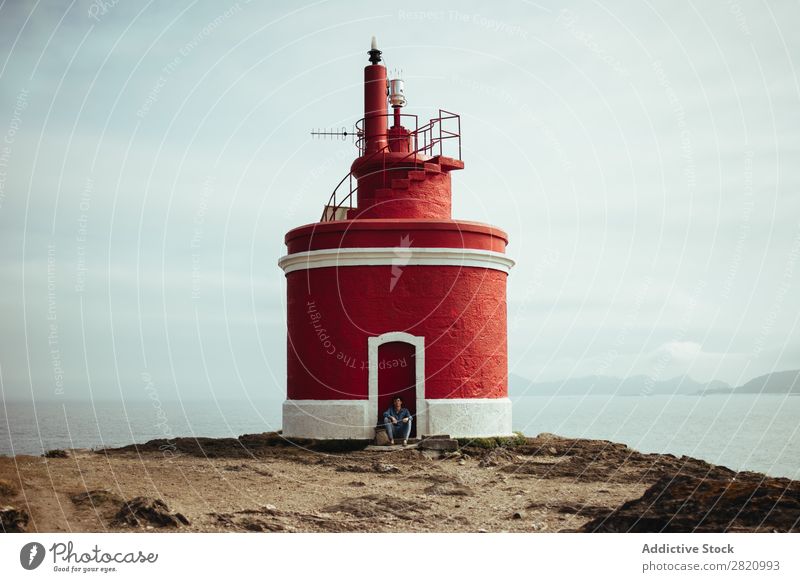 Tourist and lighthouse on coastline Human being Traveling Lighthouse Coast Nature backpacker Adventure Panorama (Format) Vantage point Landscape scenery