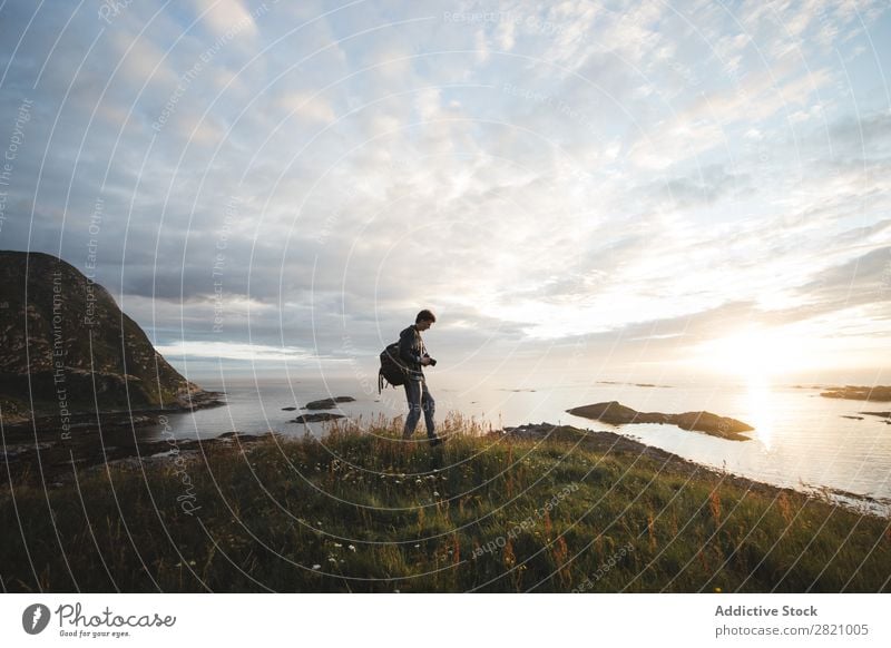 Man with backpack on landscape Backpack Freedom Landscape Vacation & Travel Nature Exterior shot Playful Coast Peaceful enjoyment Relaxation Action catching