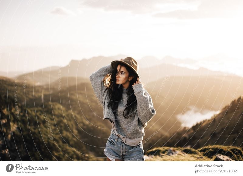 Woman standing in mountains Stand Hat Valley Posture romantic Mountain Vacation & Travel Top Rock Freedom Youth (Young adults) Nature Tourist Peak Adventure