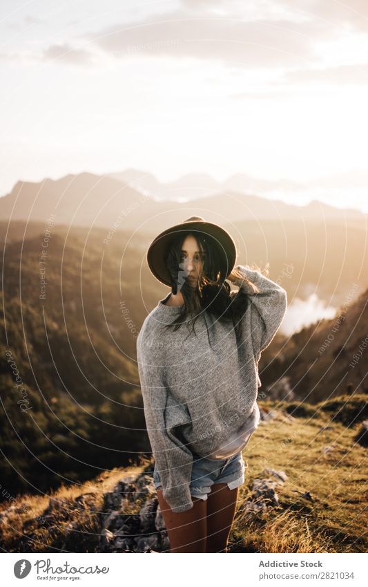 Woman standing in mountains Stand Hat Valley Posture romantic Mountain Vacation & Travel Top Rock Freedom Youth (Young adults) Nature Tourist Peak Adventure