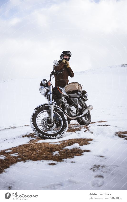 Man with motorcycle in snowy highlands Snow Motorcycle Traveling Transport Adventure Nature Panorama (Format) Tourism Trip Arranged Landscape Valley Highlands