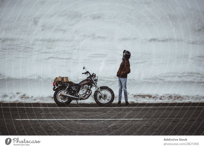 Man with motorcycle in snowy road Snow Motorcycle Traveling Transport Adventure Nature Panorama (Format) Tourism Trip Arranged Landscape Valley Highlands