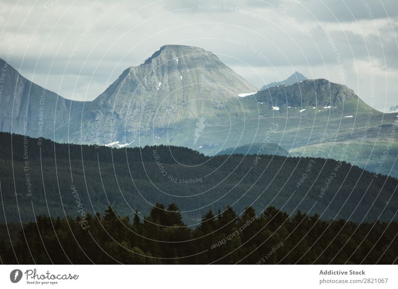 Landscape of rocky mountains at distance Mountain Panorama (Format) Dramatic terrain scenery Forest tranquil Vacation & Travel Wanderlust Adventure Serene