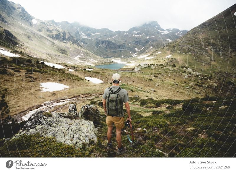 Man tourist looking at valley Tourist Hill Valley Looking Backpack Horizon Adventure Rock Mountain Freedom Peak trekking Vacation & Travel Landscape