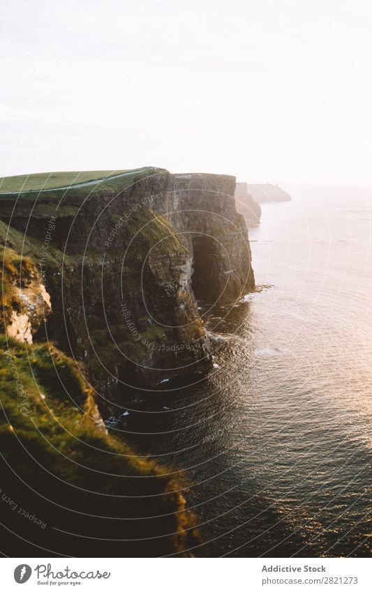 Beautiful cliff at seaside Cliff Ocean Vantage point Landscape Water Coast Vacation & Travel Nature seascape Summer Sky Rock Island Tourism Sunlight Sunset