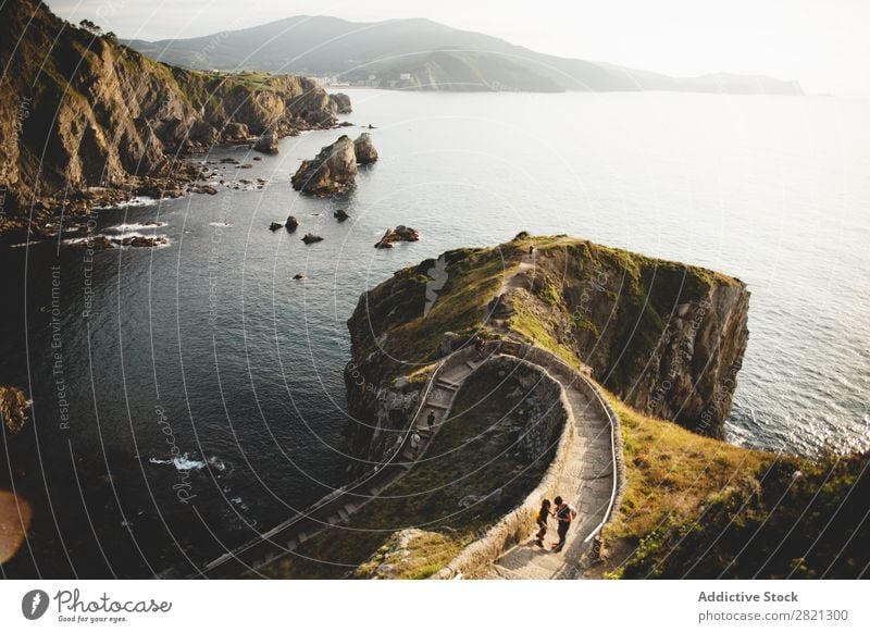 Cliff in ocean with walkway Landscape Corridor Ocean Rock Traveling Nature Dramatic tranquil Green Coast Panorama (Format) Attraction Environment seascape