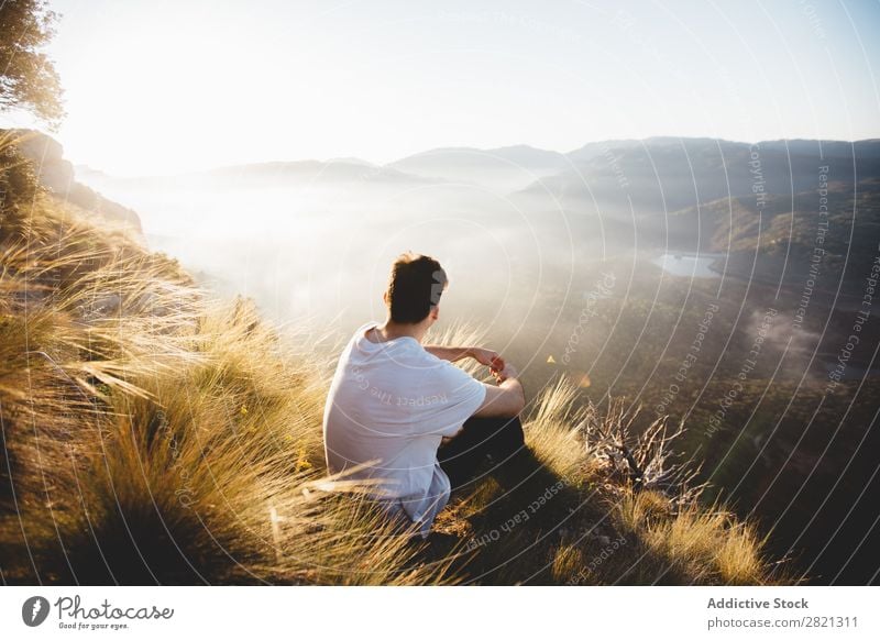 Man sitting on top of hill Mountain Landscape Vantage point PDA Network Weather Walking Relaxation Technology Tourism scenery traveler Panorama (Format)