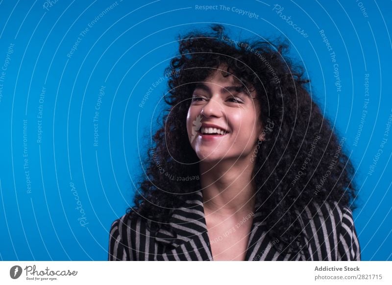 Curly woman posing in studio Woman pretty Portrait photograph Youth (Young adults) Hair Brunette holding hair Looking into the camera Beautiful Adults Posture