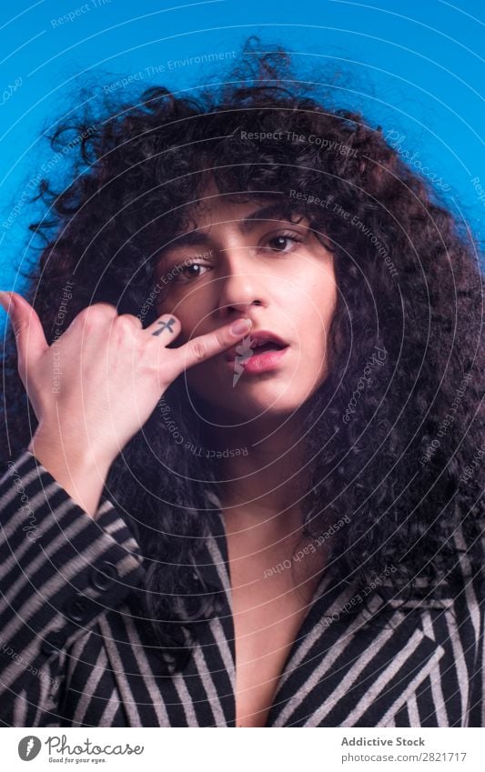 Curly woman posing in studio Woman pretty Portrait photograph Youth (Young adults) Hair Brunette Looking into the camera Beautiful Adults Posture