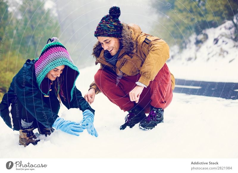 Friends playing snowballs in woods Human being Friendship Snow ball Playing Forest throwing having fun Entertainment Leisure and hobbies Action Movement Winter