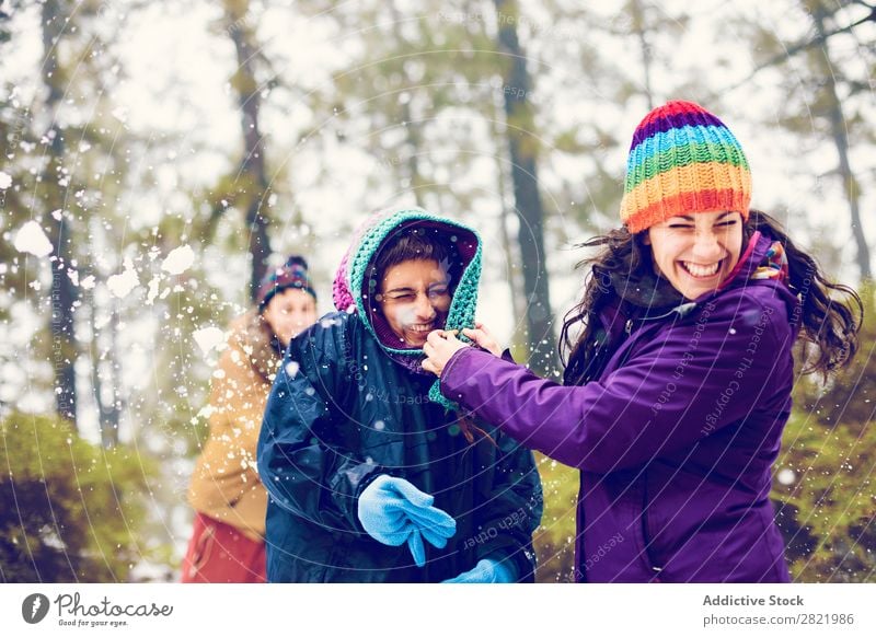 Friends playing snowballs in woods Human being Friendship Snow ball Playing Forest throwing having fun Entertainment Leisure and hobbies Action Movement Winter