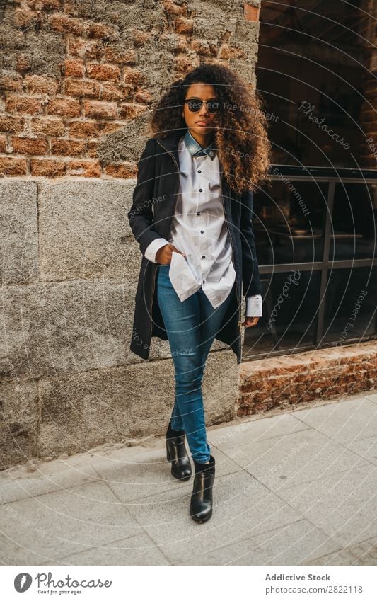 Stylish woman at brick wall Woman pretty Beautiful Ethnic Black Curly African Youth (Young adults) Stand Wall (building) Brick Street Sunglasses Brunette