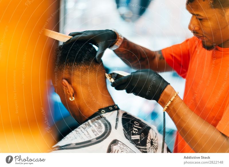 Barber using grooming machine Barber shop Customer hair dress Hair salon Hairdresser Black Man Youth (Young adults) Client Hair Stylist Hair and hairstyles