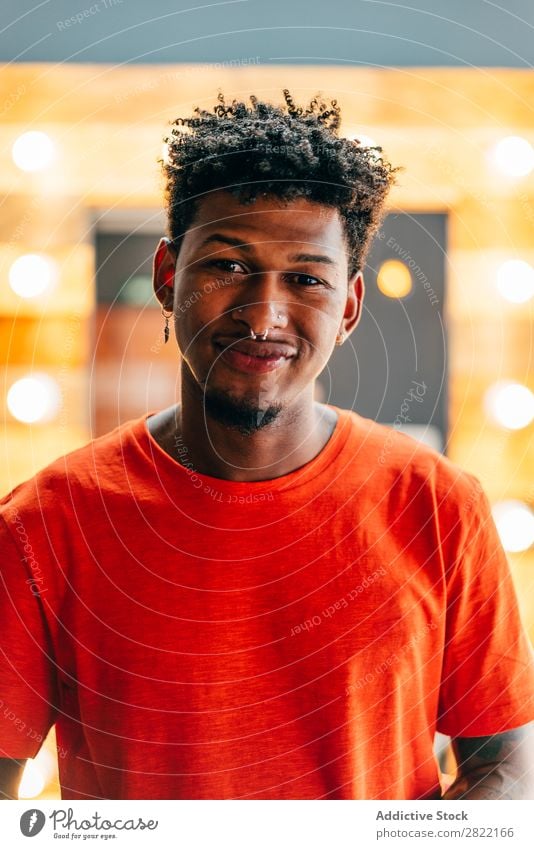 Hairdresser posing in barbershop Barber shop hair dress salon shaka Sign Gesture Looking into the camera Black Youth (Young adults) Man Hair Stylist