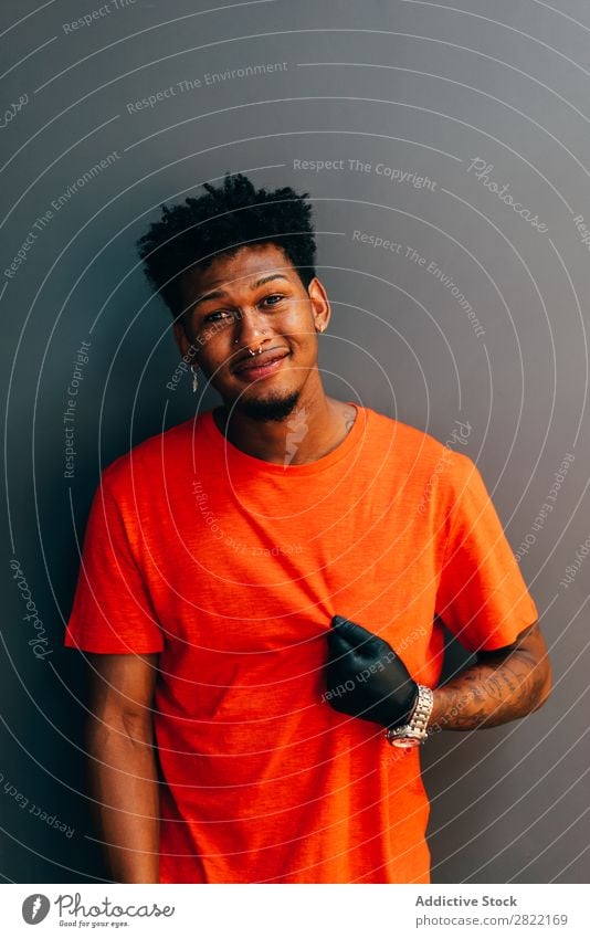 Hairdresser posing in barbershop Barber shop hair dress salon shaka Sign Gesture Looking into the camera Black Youth (Young adults) Man Hair Stylist