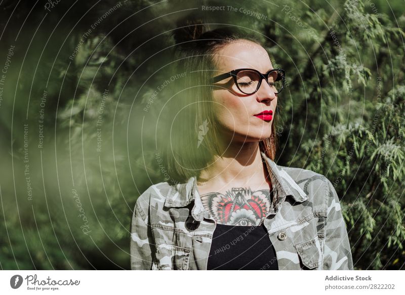 Stylish tattooed woman in nature Woman Style Nature Green enjoying Person wearing glasses eyes closed Tattoo Stand Attractive Beautiful Youth (Young adults)